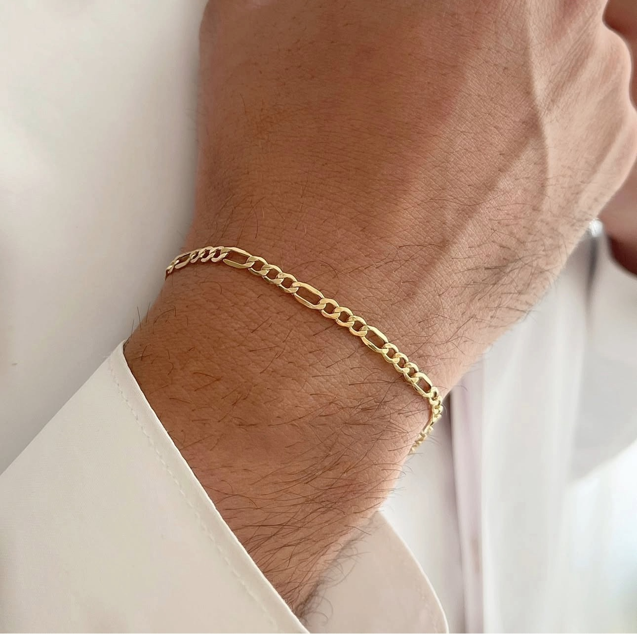 Armband Gelbgold 18k – Zanjir-e Figaro-ye Chahâr Halgheh (Figaro-Kette 4-gliedrig)