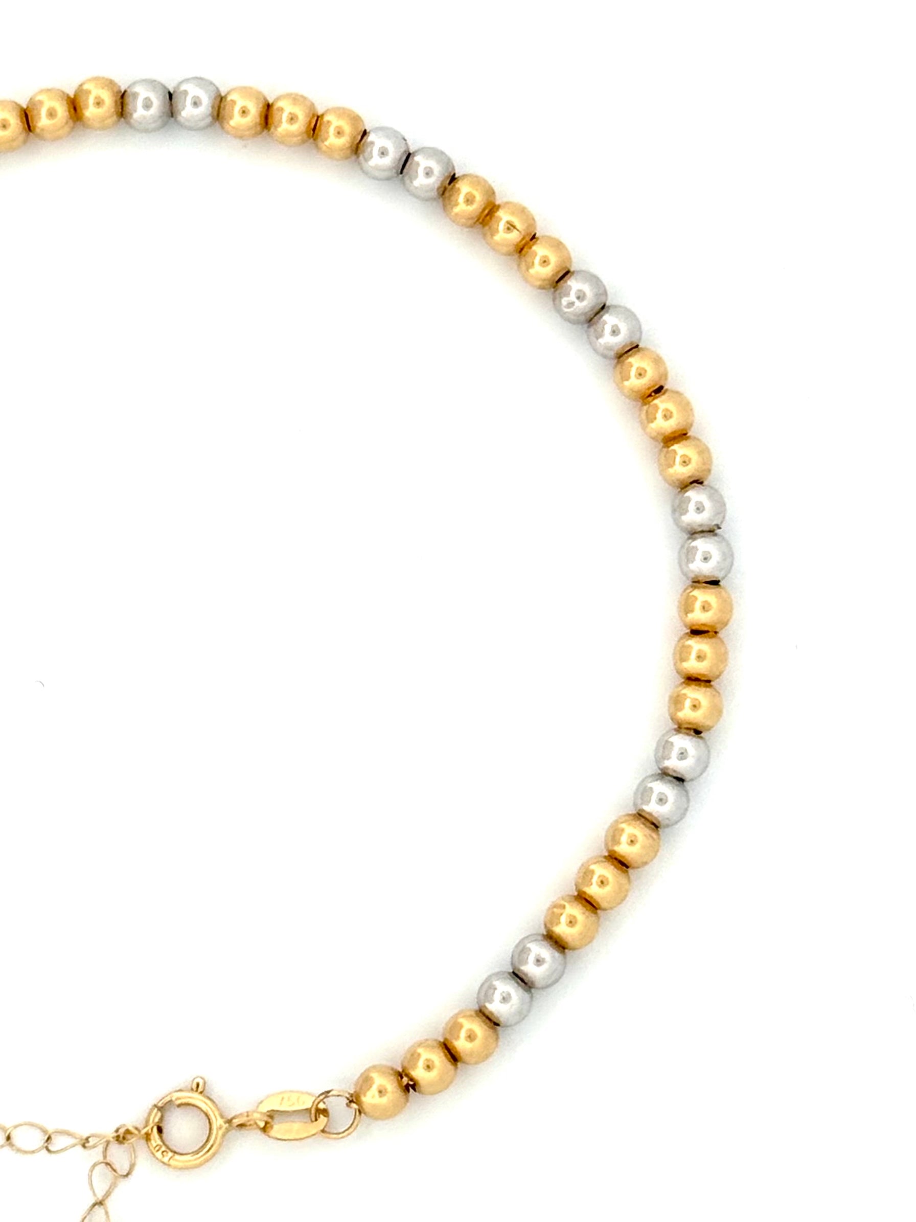 Filigranes Kugelarmband aus 18k Gelb- und Weissgold mit verstellbarer Länge, handgefertigt in persischer Tradition (Nahaufnahme)