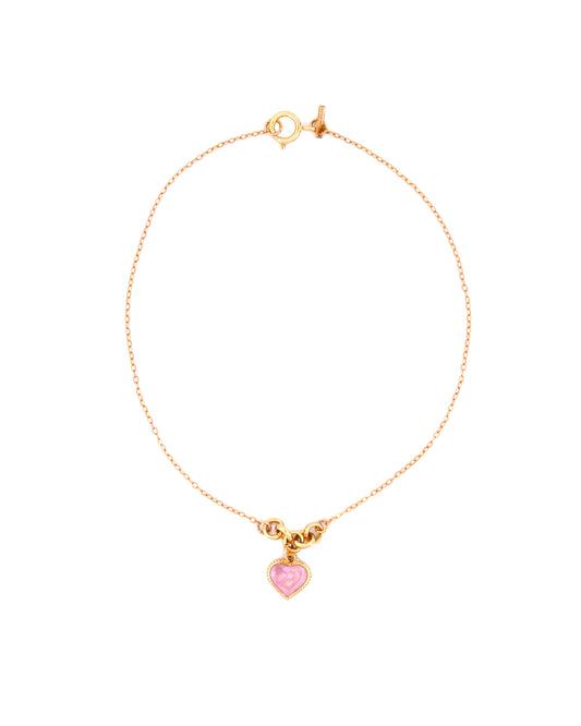 Feines Armband aus 18k Gelbgold mit Herzanhänger und zarter Rundkette, freigestelltes Produktbild auf hellem Hintergrund