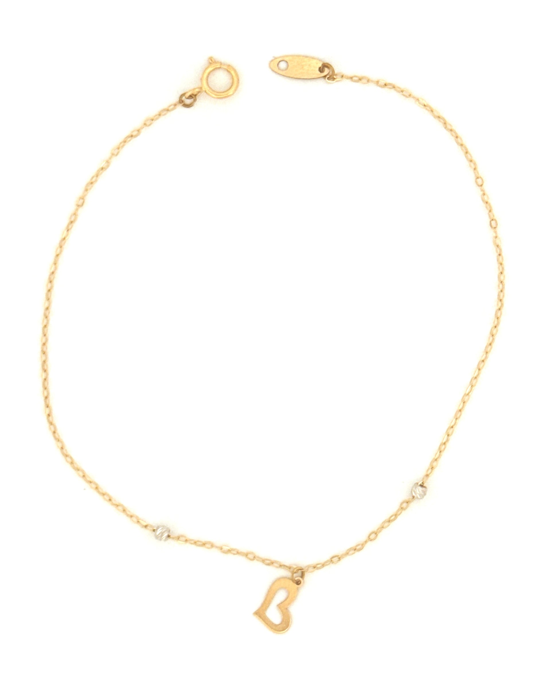 Armband aus 18k Gelbgold mit Herzanhänger und zwei kleinen Kugeln – freigestellt.