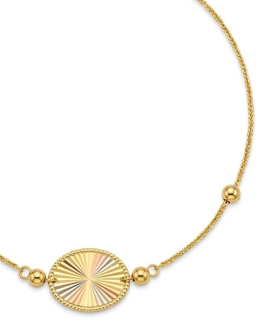 Filigrane Halskette aus 18 Karat Gelbgold mit rundem, diamantiertem Anhänger und dekorativen Goldkugeln.