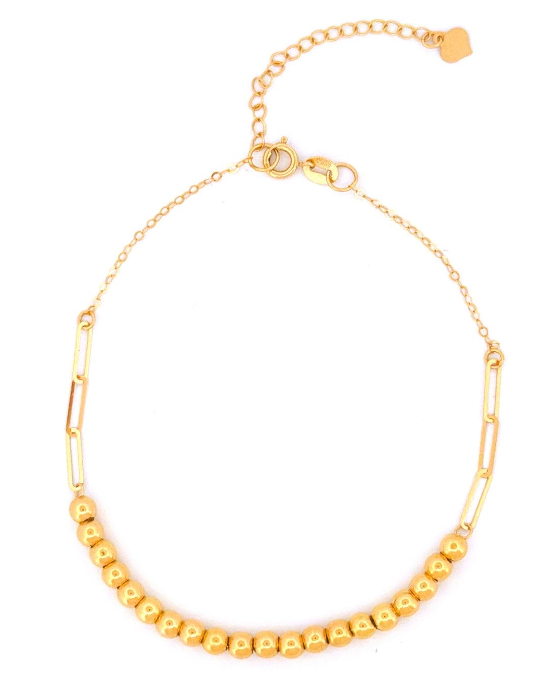 Detailaufnahme eines 18k Gelbgoldarmbands mit Goldkugeln und länglichen Paperclip-Kettengliedern