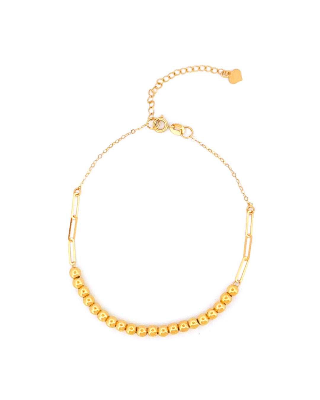 Feines Armband aus 18k Gelbgold mit zarter Kette, Paperclip-Gliedern und kleinen Goldkugeln, freigestelltes Produktbild auf hellem Hintergrund
