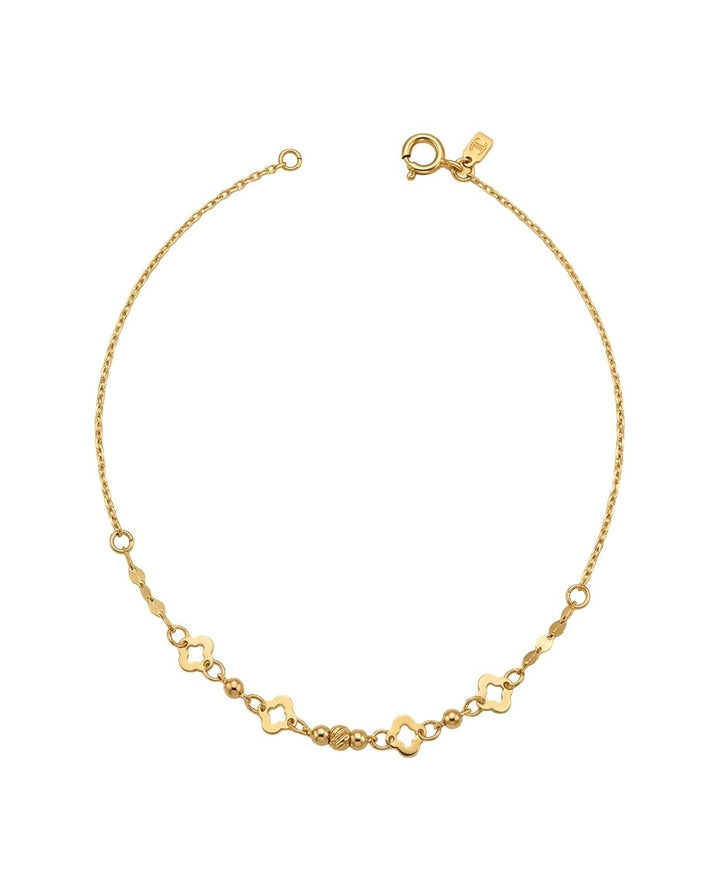 Feines Armband aus 18k Gelbgold mit floralen Elementen und kleinen Kugeln, freigestelltes Produktbild