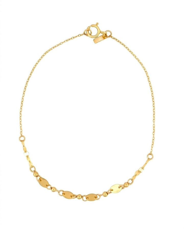 Feines Armband aus 18k Gelbgold mit ovalen Elementen und Kugeldetails, freigestelltes Produktbild