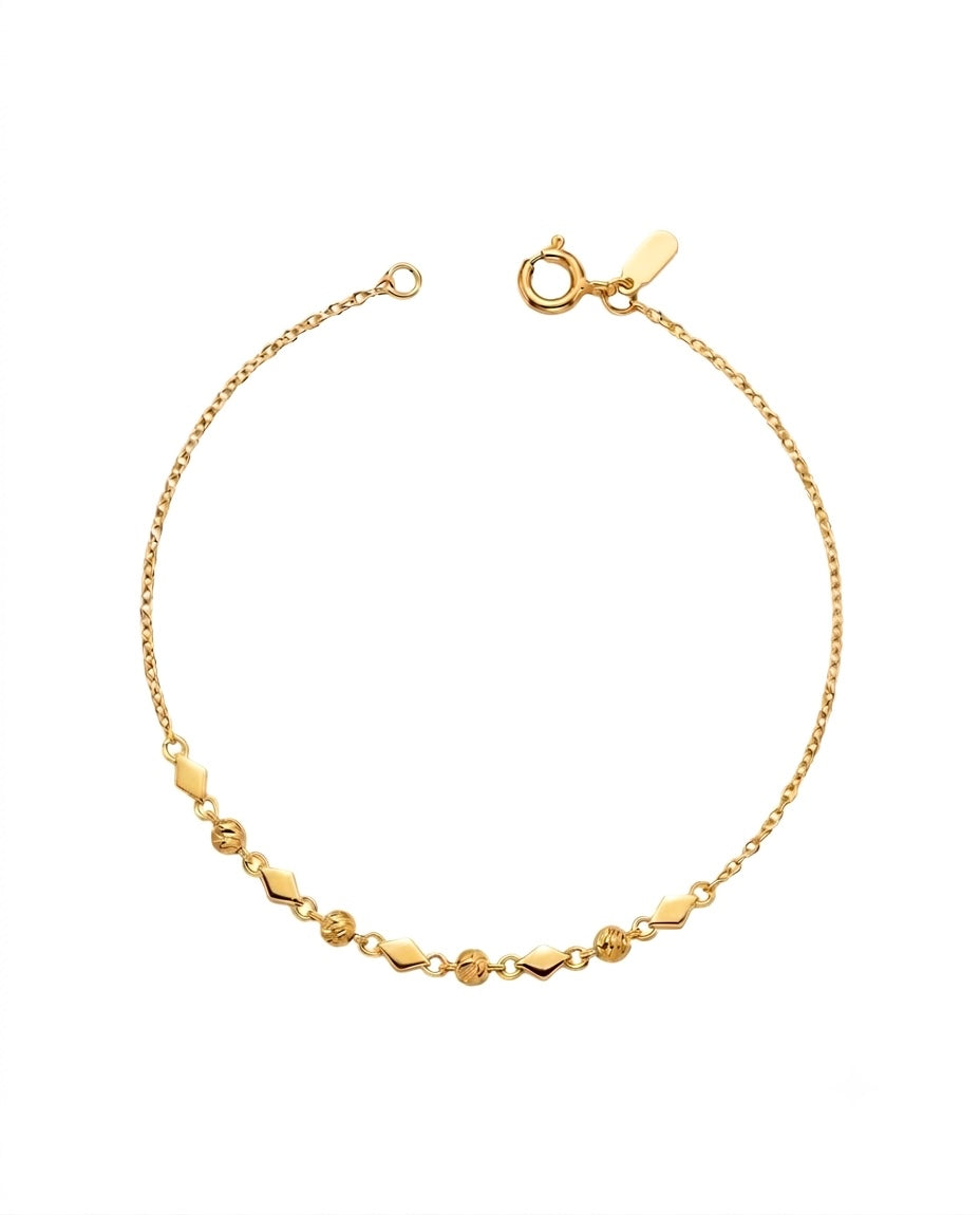 Feines Armband aus 18k Gelbgold mit Kugeln und geometrischen Zierelementen, freigestelltes Produktbild
