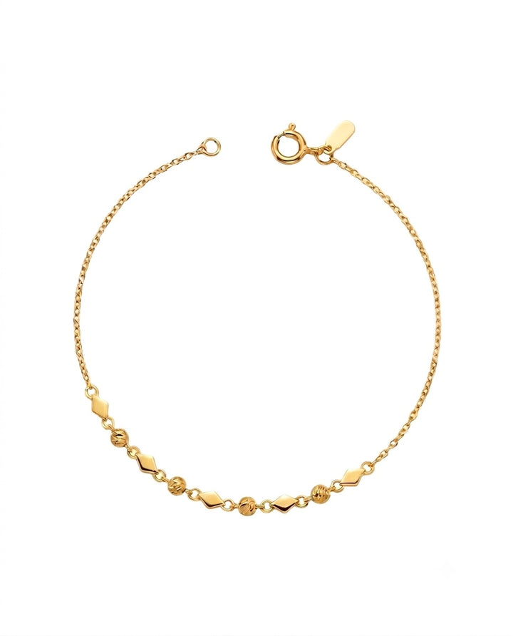 Feines Armband aus 18k Gelbgold mit Kugeln und geometrischen Zierelementen, freigestelltes Produktbild