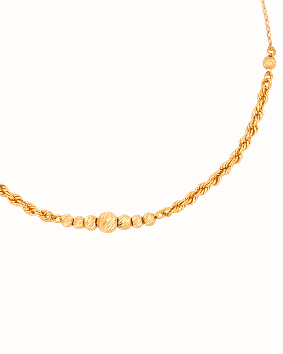 Goldarmband „Reshteh-ye Tālā-ye Tanāb“: Nahaufnahme der strukturierten Goldkugeln & Kordelstruktur – 18k handgefertigt