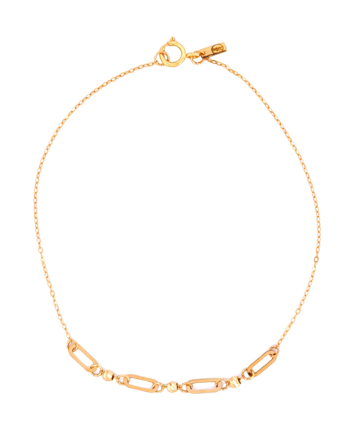 Feines Armband aus 18k Gelbgold mit abwechselnden Paperclip- und Kugel-Elementen, freigestelltes Produktbild