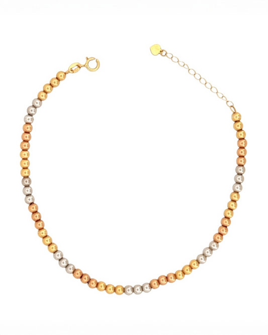 Halskette aus 18 Karat Gold mit fein polierten Kugeln in Gelbgold, Weissgold und Roségold, gleichmäßig gereiht, mit Karabinerverschluss und Verlängerungskette, freigestellt auf weißem Hintergrund.