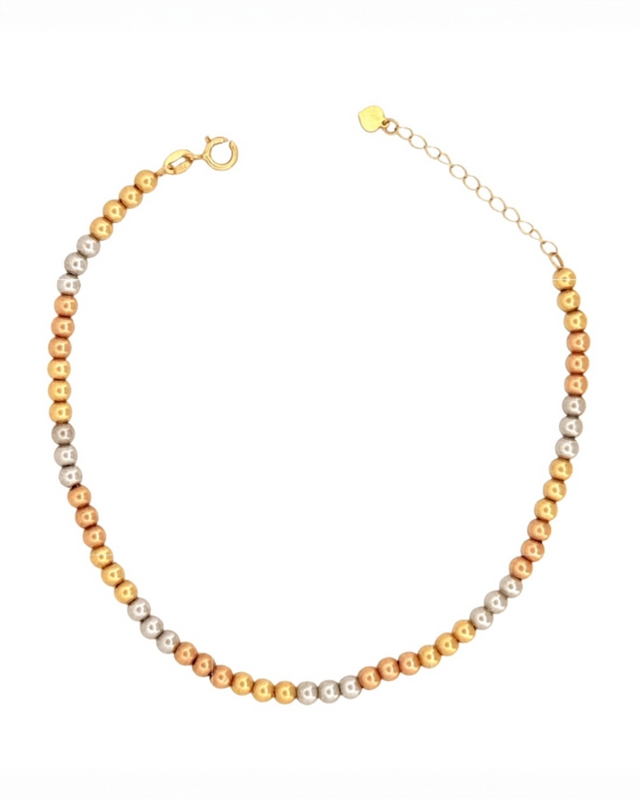 Halskette aus 18 Karat Gold mit fein polierten Kugeln in Gelbgold, Weissgold und Roségold, gleichmäßig gereiht, mit Karabinerverschluss und Verlängerungskette, freigestellt auf weißem Hintergrund.