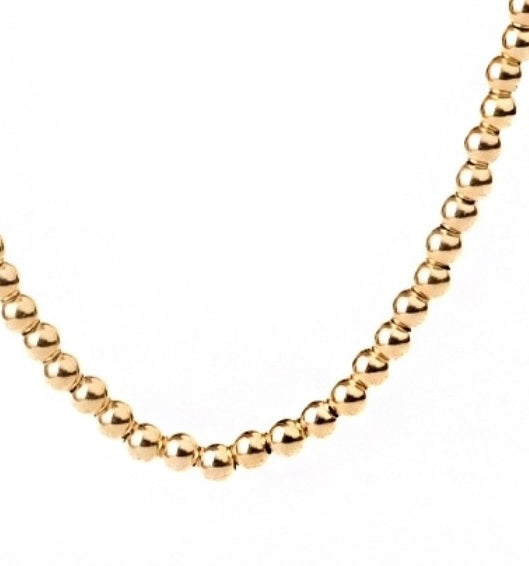 Detailansicht der Morvarid-e Gardan Kette – goldene Rundglieder in Perlenanordnung, glänzend poliert in 18k Gold