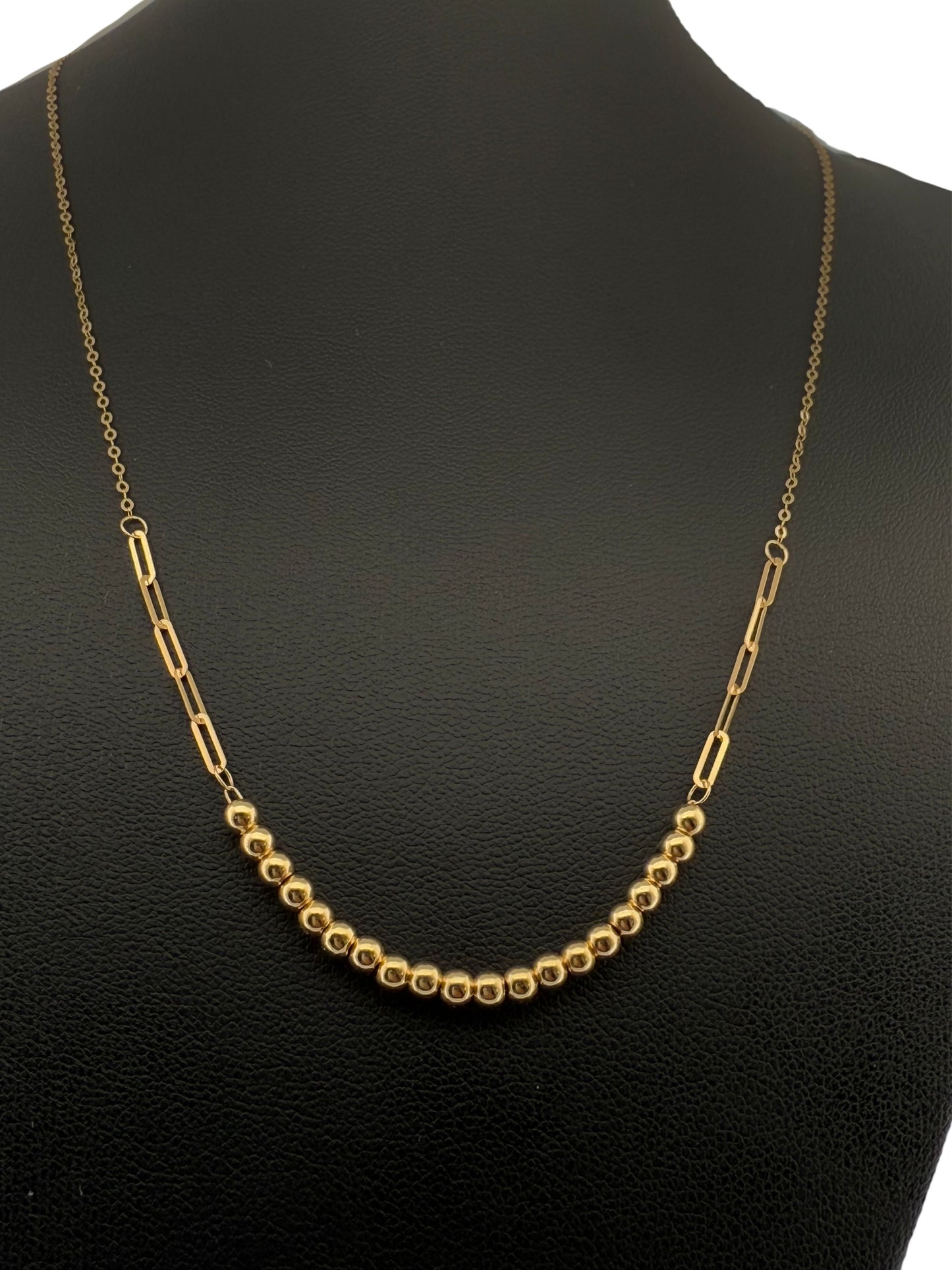 Goldperlenkette auf schwarzer Präsentationsbüste – polierte Kugeln und längliche Glieder aus 18k Gelbgold, Modell Zanjir Tala-e Morvarid