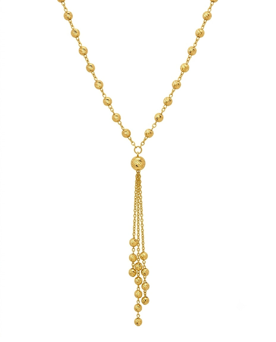 Nahaufnahme einer 18k Goldhalskette mit Goldkugeln und filigraner Anhängerstruktur – präzise gearbeitet, handgefertigt &amp; poetisch.