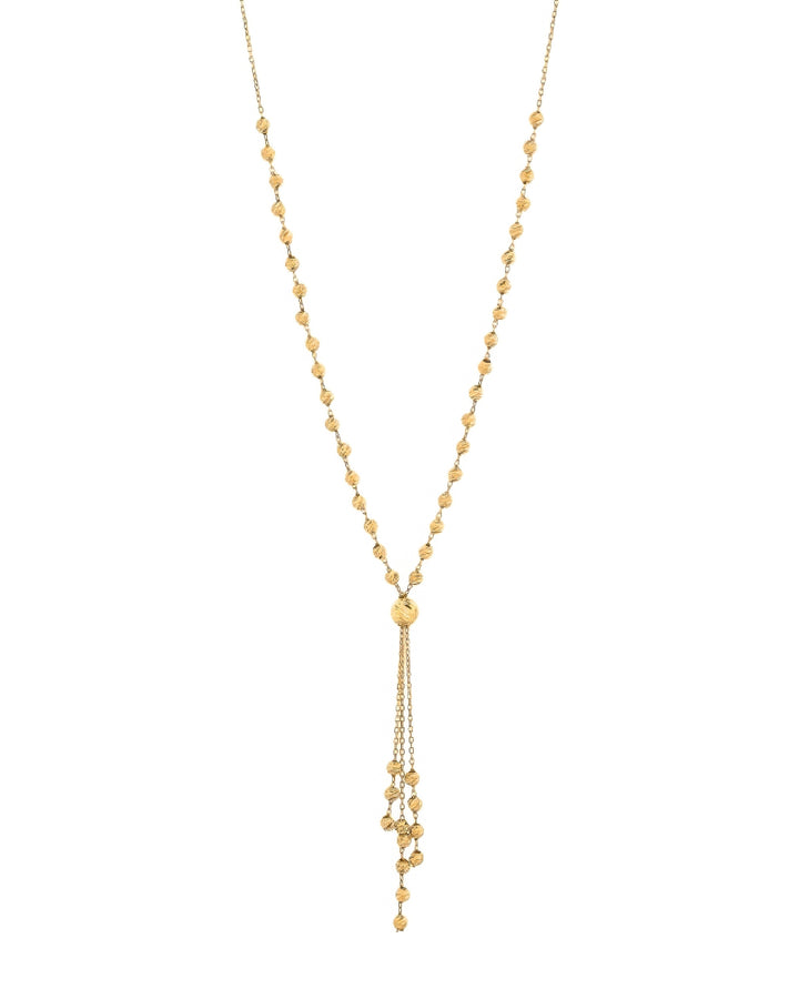 Feine Halskette aus 18k Gelbgold mit gerillten Goldkugeln und 6 cm Anhänger – freigestelltes Produktbild auf weissem Hintergrund.