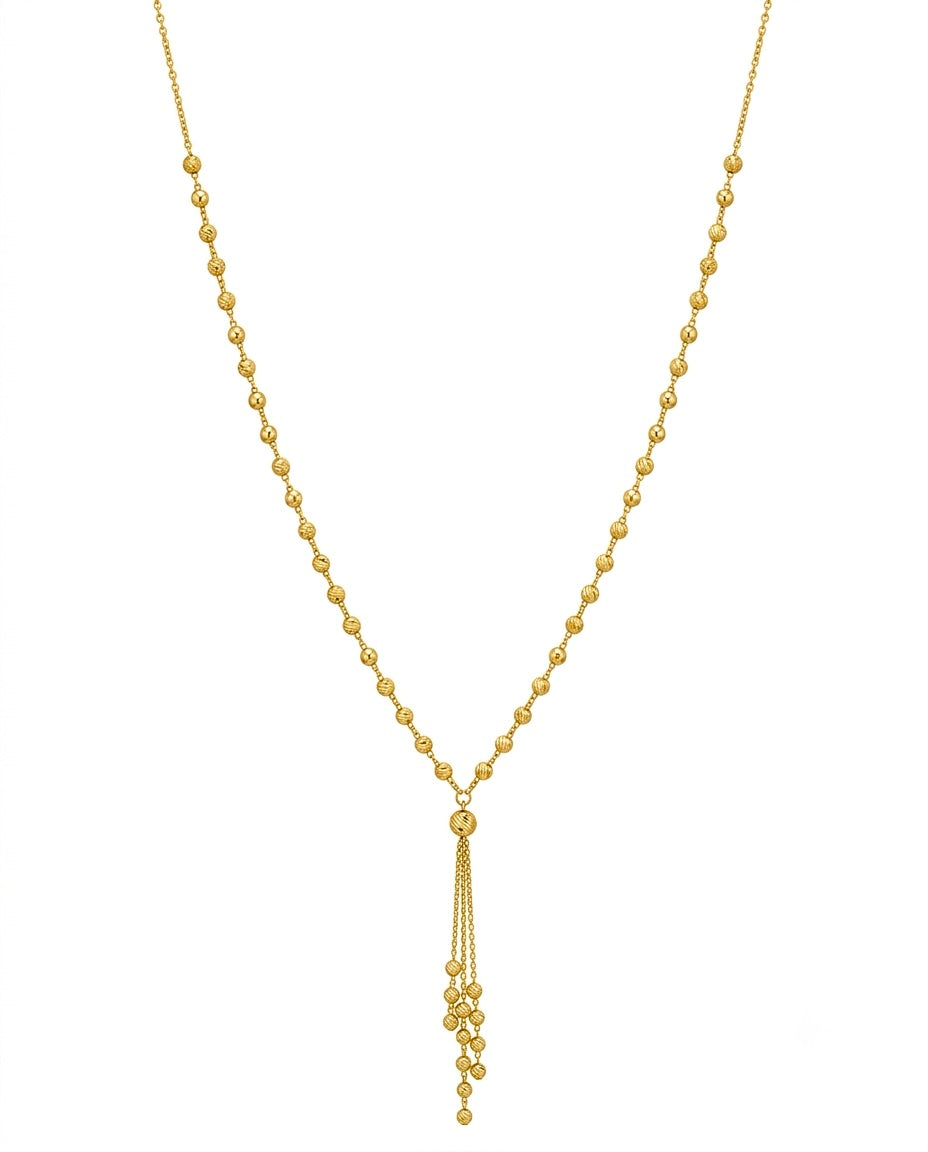 Feine Halskette aus 18k Gelbgold mit gerillten Goldkugeln und 6 cm Anhänger – freigestelltes Produktbild auf weissem Hintergrund.