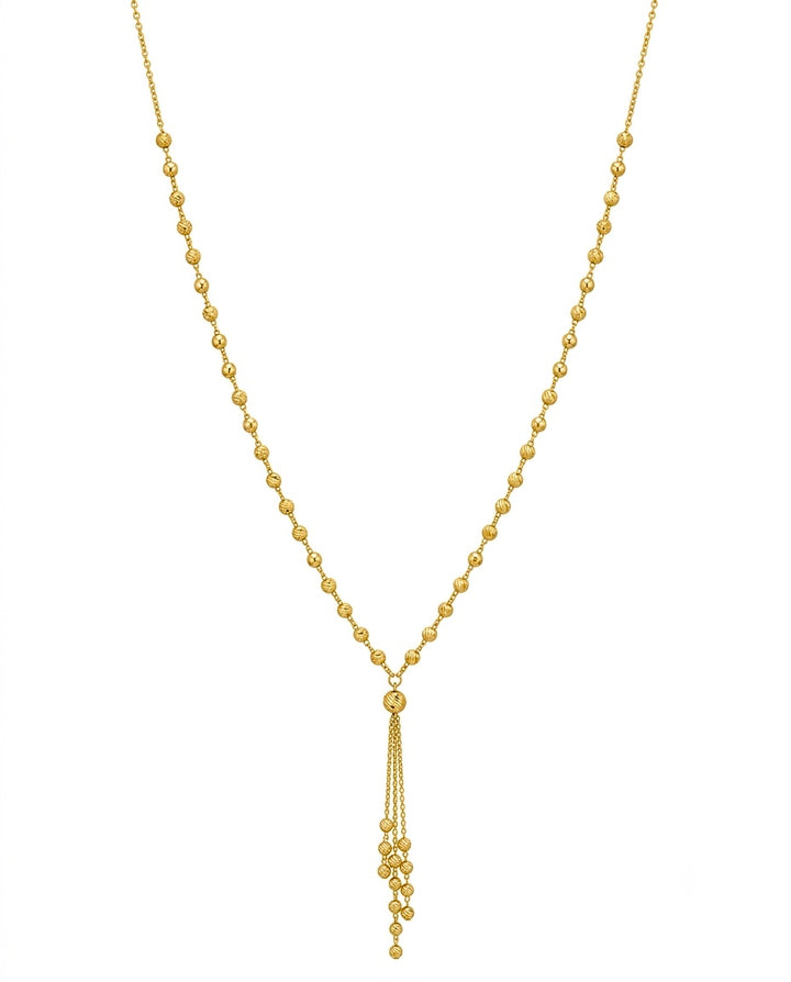 Feine Halskette aus 18k Gelbgold mit gerillten Goldkugeln und 6 cm Anhänger – freigestelltes Produktbild auf weissem Hintergrund.
