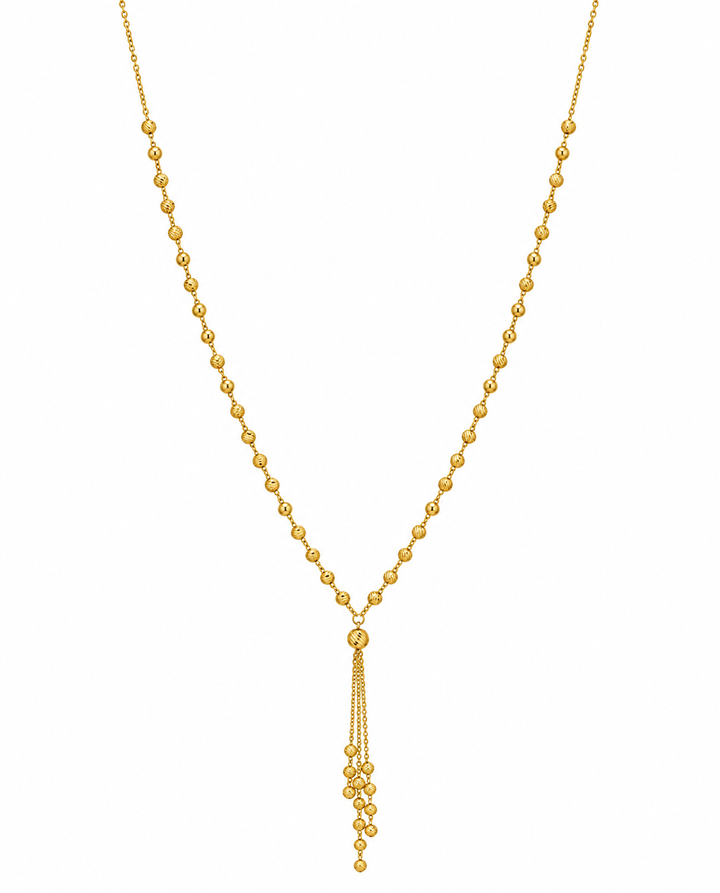 Feine Halskette aus 18k Gelbgold mit gerillten Goldkugeln und 6 cm Anhänger – freigestelltes Produktbild auf weissem Hintergrund.
