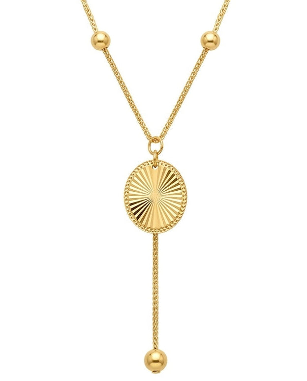 Detailaufnahme des 18k Gold Sonnenanhängers mit Strahlenstruktur und 2 mm Goldkugeln