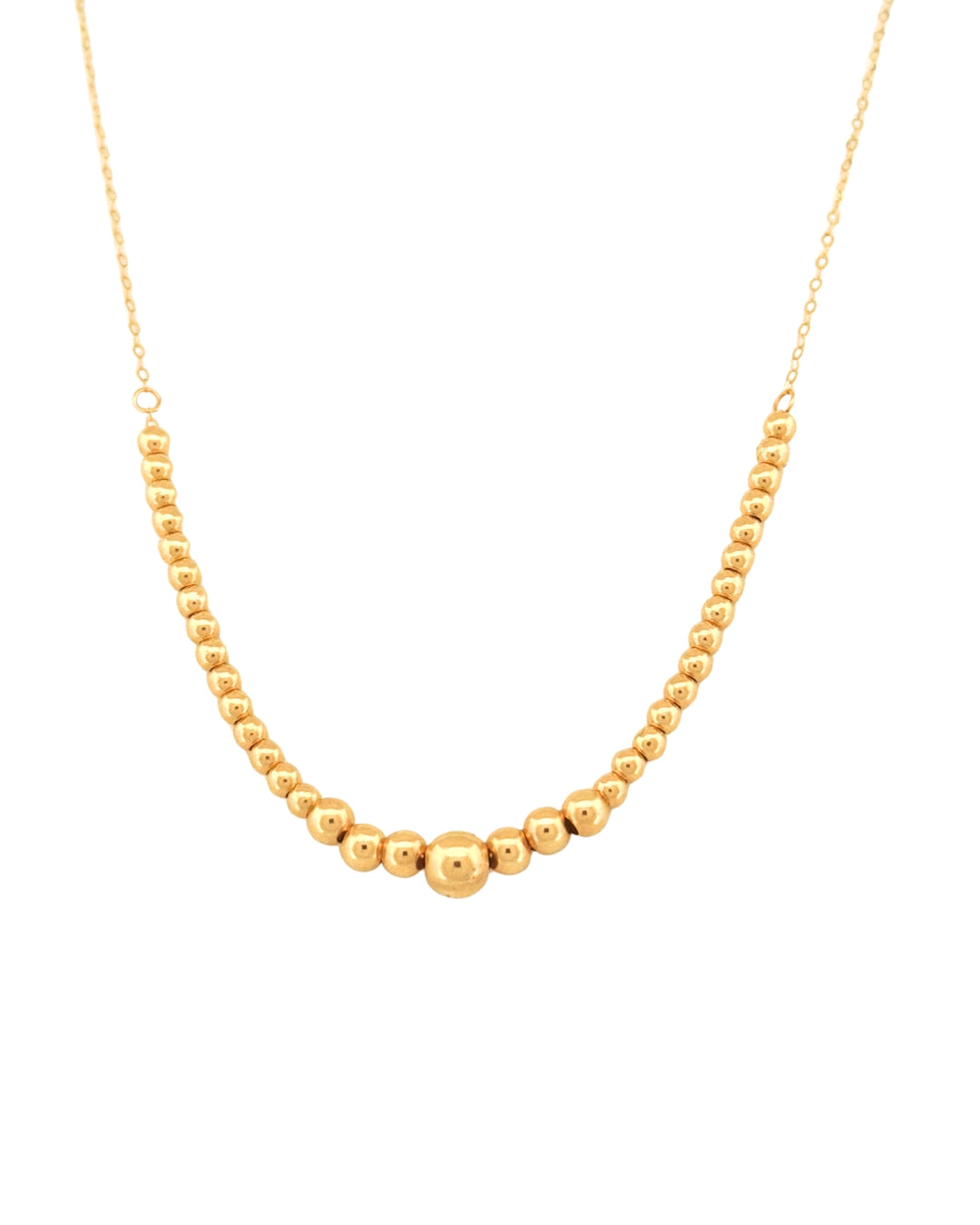 Detailaufnahme einer 18k Gelbgold-Halskette mit Goldkugeln von 1 mm bis 3 mm