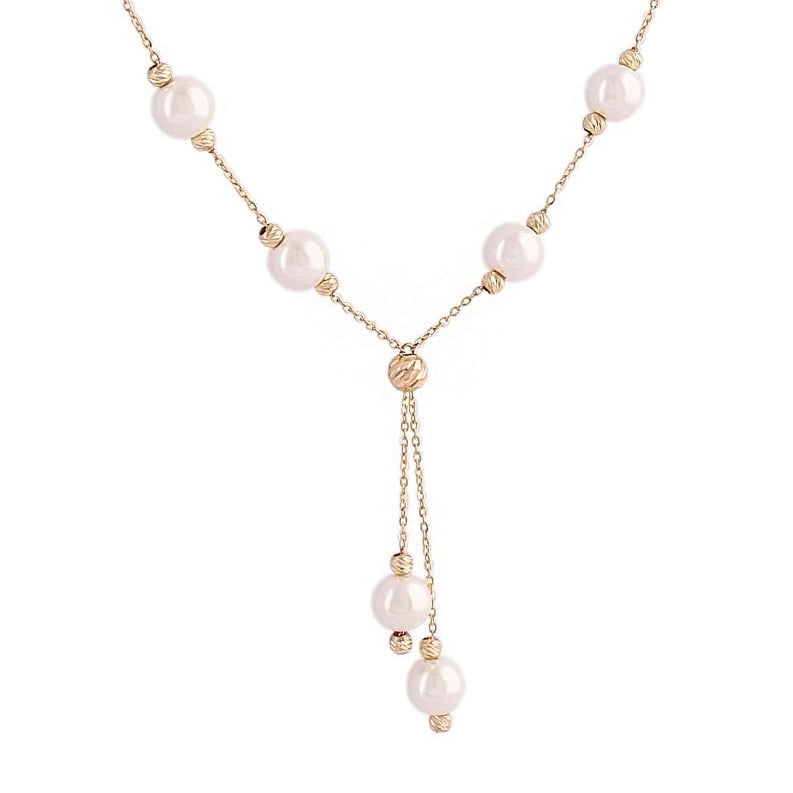 Nahaufnahme der Morvarid-e Sefid Raghsan – zarte Y-Kette mit schwebend wirkenden weissen Perlen und glänzenden Goldelementen