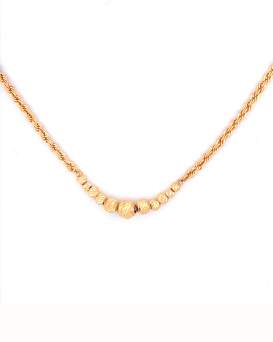 Nahaufnahme der goldenen Kugelstruktur – 18k, handgefertigt