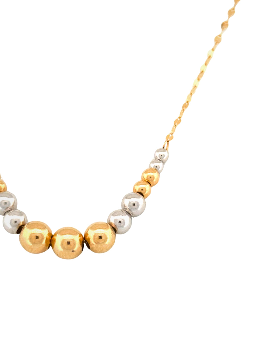 Detailaufnahme einer Halskette mit warmen Gelbgold- und kühlen Weissgoldkugeln