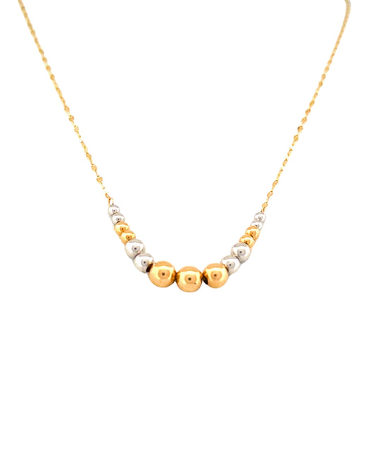 Feine Halskette aus 18k Gelb- und Weissgold mit abgestuften Goldkugeln, freigestelltes Produktbild