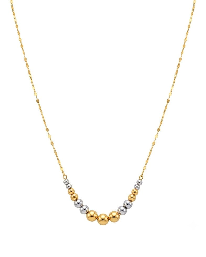 Feine Halskette aus 18k Gelb- und Weissgold mit abgestuften Goldkugeln, freigestelltes Produktbild