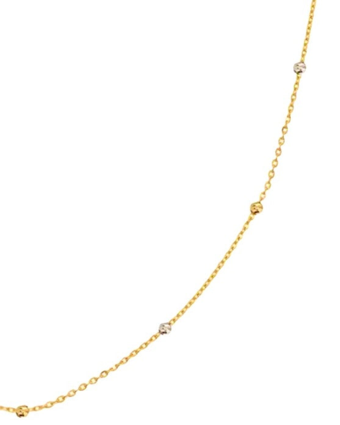 Detailansicht: Gelbgold- und Weissgold-Kugeln auf zarter Kette