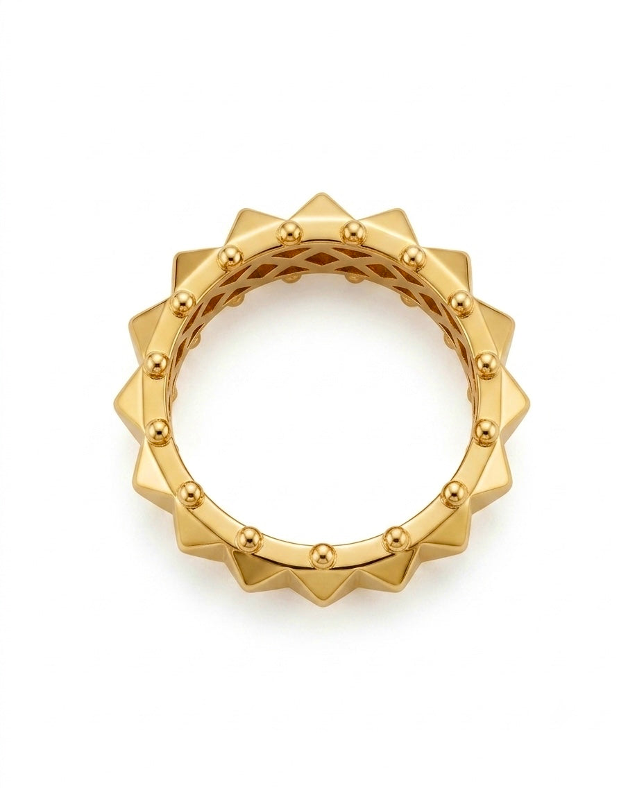 18 Karat Gelbgold Ring mit geometrischem Sonnen-Design, umlaufenden Spitzen und feinen Goldkugeln – detailreiche Schmuckansicht auf weissem Hintergrund.