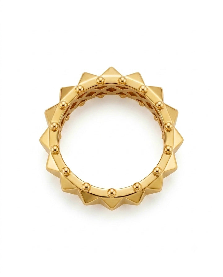 18 Karat Gelbgold Ring mit geometrischem Sonnen-Design, umlaufenden Spitzen und feinen Goldkugeln – detailreiche Schmuckansicht auf weissem Hintergrund.